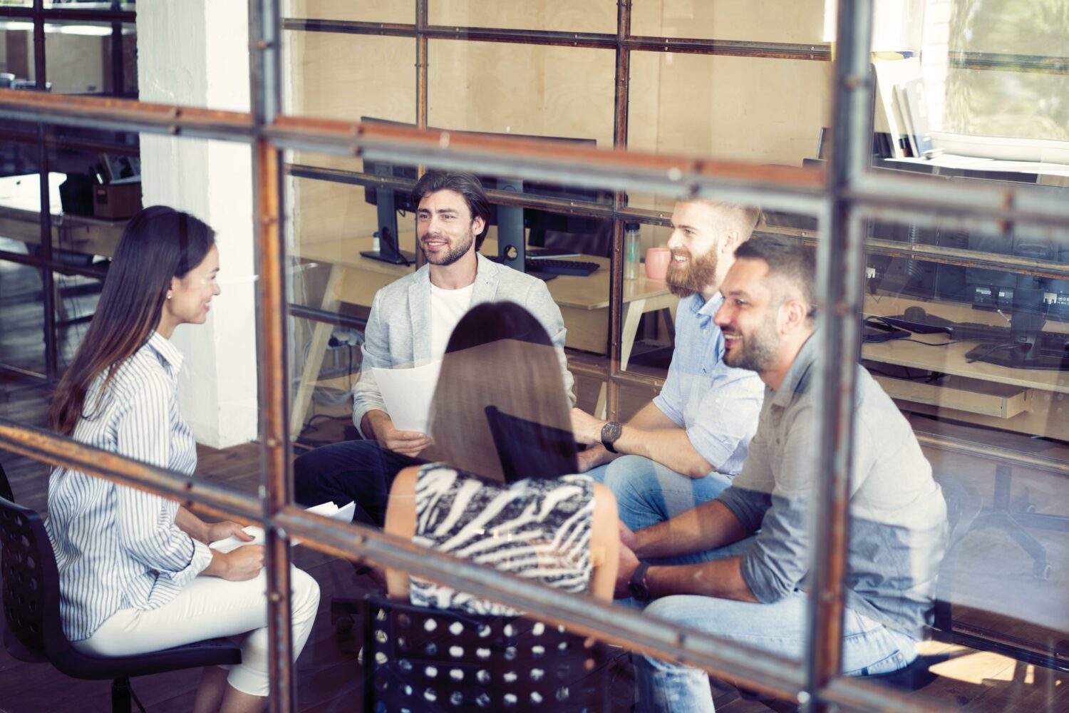 Young creative people in modern office. Group of young business people are working together with laptop, tablet, smart phone, notebook. Successful hipster team in coworking. Freelancers.